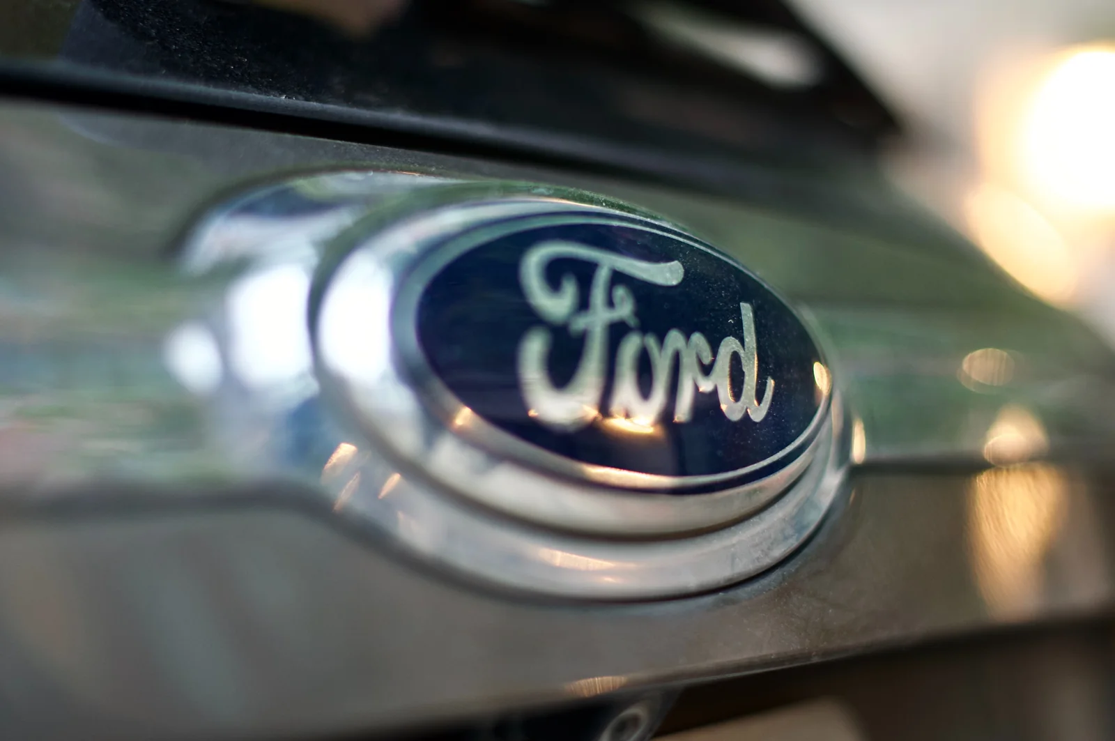 Close-up of the Ford oval badge on the front of a vehicle