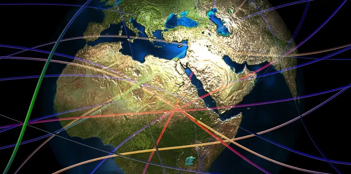 Globe with colored lines of connected routes crossing Europe, Africa and the Middle East