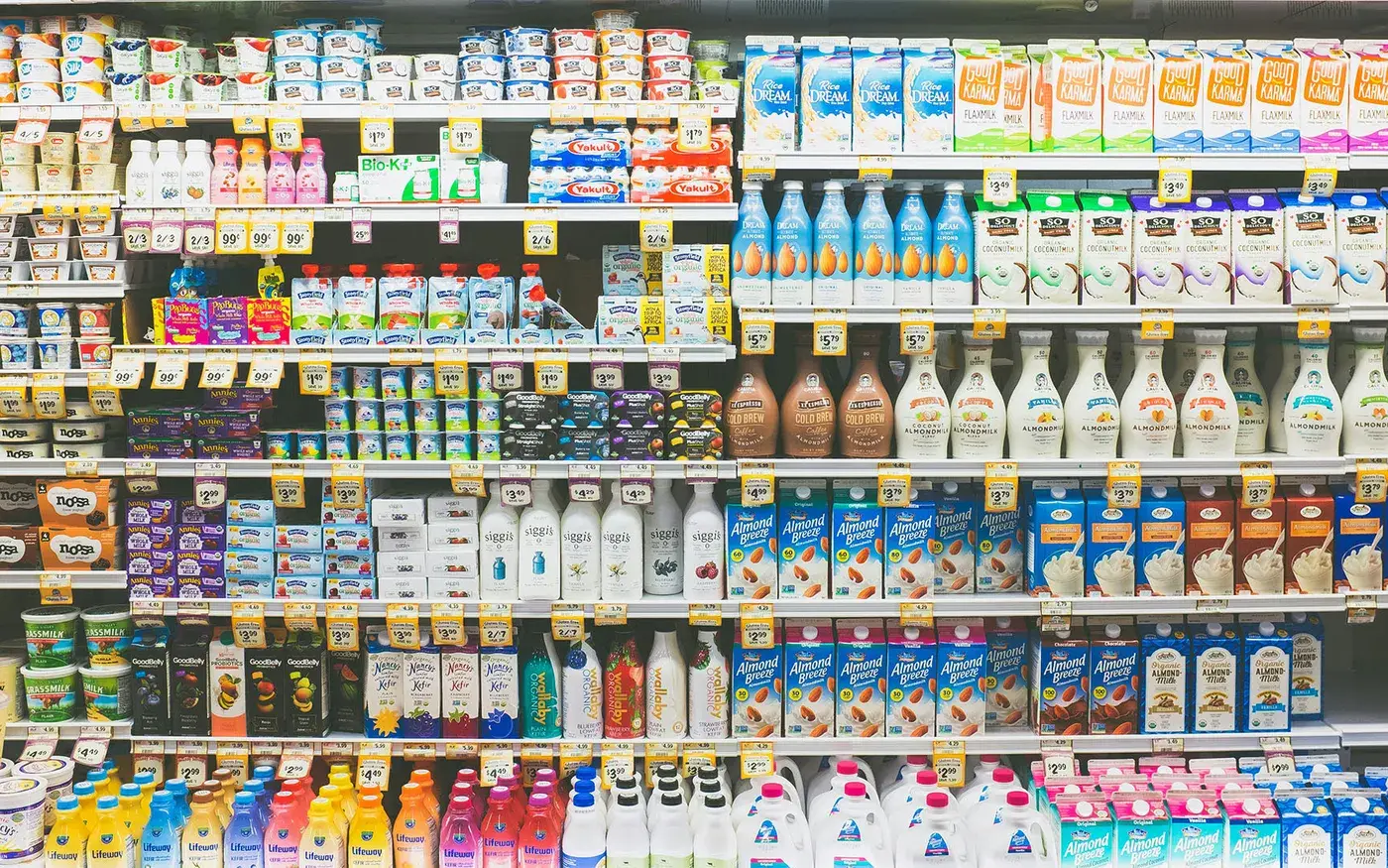 Supermarket shelves stocked with packaged food and drinks