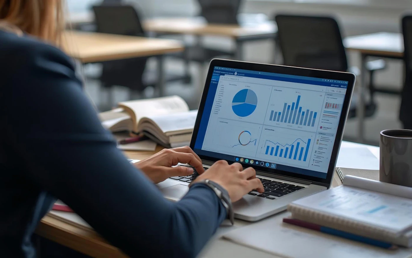 Analyst reviewing charts on a laptop